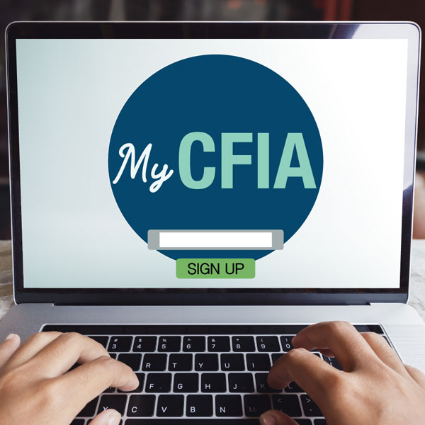 A laptop opened to the My CFIA sign up page
