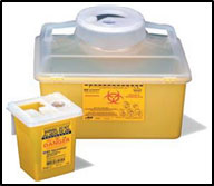 A picture of 2 plastic sharp container bins with lids. Prominent labels and instructions are posted on the front of the bins.